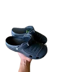 A pair of Crocs Classic Clogs in a greyish-blue color.